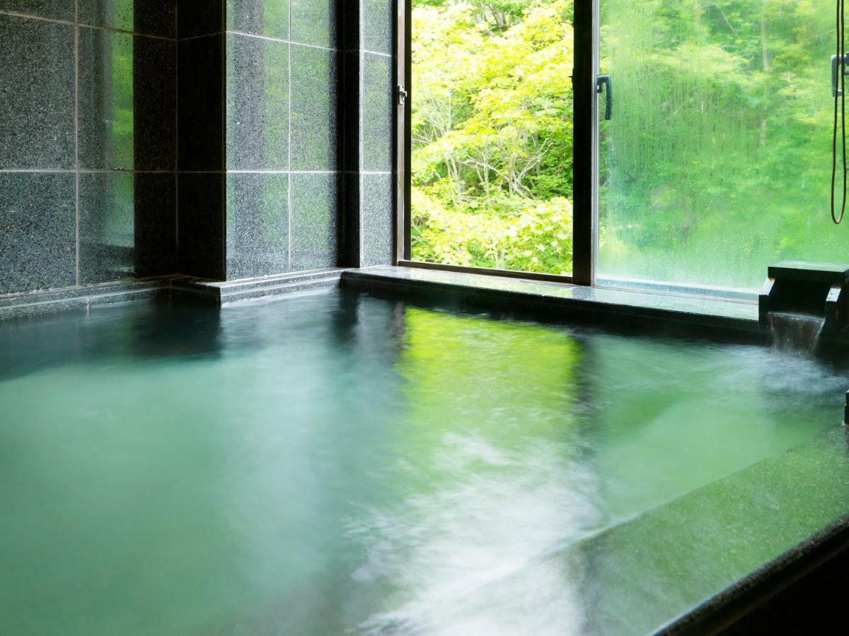 Отель Niseko Konbu Onsen Tsuruga Moku-No-Sho Экстерьер фото